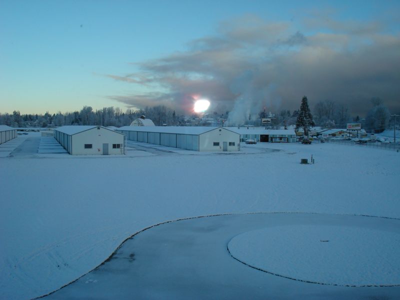 Snow covered hangars and buildings